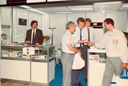 Dr. Fischer draws his own blood to demonstrate Ultradent’s first product, Astringedent® hemostatic, at an early trade show.